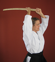 Woman with bokken raised